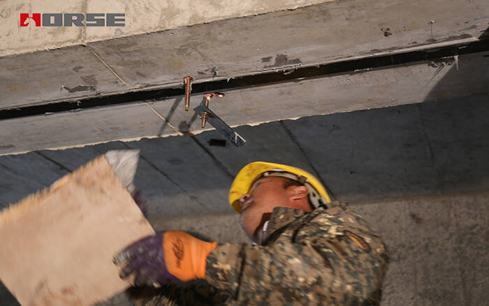 Prestressed CFRP Laminate To Reinforce The Underground Parking Lot