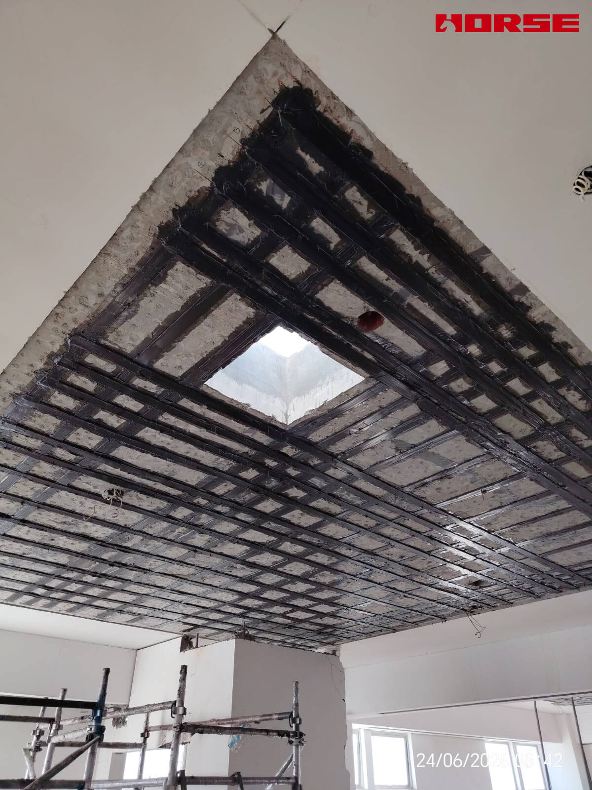 Carbon Fiber Plate Strengthening of RC Slabs with Openings